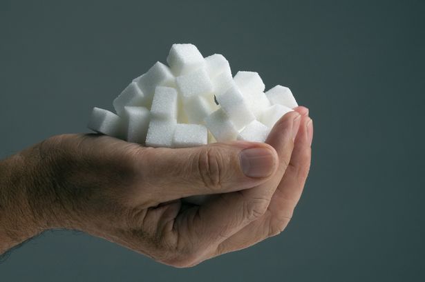 Hand-holding-sugar-cubes
